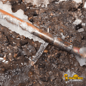 A frozen and busted uninsulated copper pipe due to extreme cold temperatures.